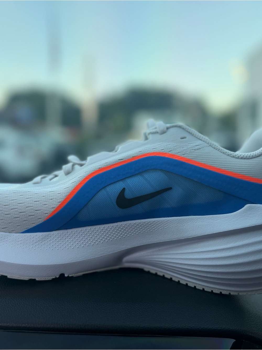 Nike Men’s White Sneakers with Blue Panels and Orange Trim